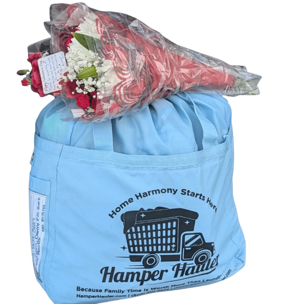 Hamper Hauler blue laundry delivery bag with a Valentine's Day flower bouquet.
